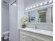 Bright bathroom featuring a marble countertop, soft lighting, and white cabinetry at 242 Cheyenne Rd, Summerville, SC 29483