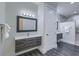 Modern bathroom with a large vanity and a walk-in shower with marble-patterned tile at 242 Cheyenne Rd, Summerville, SC 29483