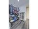 Well-organized walk-in closet with clothing racks, storage cabinet, and hardwood flooring at 242 Cheyenne Rd, Summerville, SC 29483