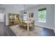Bright dining area features stylish light fixture, neutral colored walls, and natural light at 242 Cheyenne Rd, Summerville, SC 29483