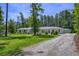 Lovely single-story home with well-maintained lawn and charming landscaping at 242 Cheyenne Rd, Summerville, SC 29483