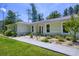 Lovely home with a well-manicured front yard and walkway leading to the entrance at 242 Cheyenne Rd, Summerville, SC 29483
