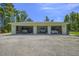 Three-car detached garage with ample storage space for vehicles and equipment at 242 Cheyenne Rd, Summerville, SC 29483
