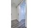 Hallway with a modern barn door leading to another room and hardwood floors at 242 Cheyenne Rd, Summerville, SC 29483