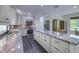 Kitchen boasts granite counters, stainless appliances, and ample cabinet space at 242 Cheyenne Rd, Summerville, SC 29483