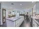 Open concept kitchen with granite island, stainless steel appliances, and wood flooring at 242 Cheyenne Rd, Summerville, SC 29483
