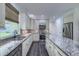 Well-lit kitchen with granite countertops, stainless steel appliances, and ample cabinet space at 242 Cheyenne Rd, Summerville, SC 29483