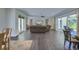 Open living space showcasing hardwood floors, recessed lights, dining area, and outdoor patio at 242 Cheyenne Rd, Summerville, SC 29483