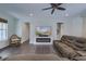 Comfortable living room showcasing recessed lighting, fireplace, ceiling fan, hardwood floors, and neutral colors at 242 Cheyenne Rd, Summerville, SC 29483