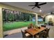 Covered patio with outdoor dining and views of the expansive backyard at 242 Cheyenne Rd, Summerville, SC 29483