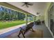Spacious covered patio with outdoor seating, ceiling fans, and a view of the backyard at 242 Cheyenne Rd, Summerville, SC 29483
