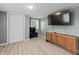 The unfurnished basement is ready for entertaining, featuring a TV, door, and window at 245 Lake Dr, Summerville, SC 29483