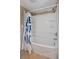 This bathroom features a shower and bathtub combination with a white shower curtain at 245 Lake Dr, Summerville, SC 29483