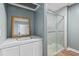 This bathroom features a sink, mirror, cabinet, and a shower at 245 Lake Dr, Summerville, SC 29483