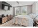 A bright bedroom is complemented by a flat-screen TV and a ceiling fan at 245 Lake Dr, Summerville, SC 29483