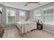 Sunlit bedroom with neutral walls and a decorative ceiling fan at 245 Lake Dr, Summerville, SC 29483