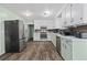 Kitchen with stainless appliances, white cabinets and hardwood floors at 245 Lake Dr, Summerville, SC 29483
