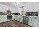 A well-equipped kitchen features stainless appliances and abundant cabinet space at 245 Lake Dr, Summerville, SC 29483