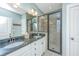 Elegant bathroom featuring a double sink vanity with granite countertop and a frameless glass shower at 246 Slipper Shell Ct, Mount Pleasant, SC 29464