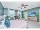 Bright bedroom with a large bed, natural light, and a television for comfortable relaxation at 246 Slipper Shell Ct, Mount Pleasant, SC 29464