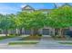 Charming townhomes featuring brick facade, attached garages, manicured lawns, and beautiful landscaping at 246 Slipper Shell Ct, Mount Pleasant, SC 29464
