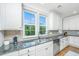 Bright kitchen showcasing sleek appliances, subway tile backsplash, and granite counters at 246 Slipper Shell Ct, Mount Pleasant, SC 29464
