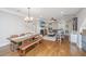 Open concept living/dining room featuring hardwood floors, modern lighting and fireplace at 246 Slipper Shell Ct, Mount Pleasant, SC 29464