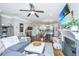 Inviting living room featuring hardwood floors, a cozy fireplace, and an open layout leading to the kitchen at 246 Slipper Shell Ct, Mount Pleasant, SC 29464