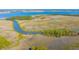 Beautiful marshland landscape with tidal creeks, wooden pier and spartina grass at 246 Slipper Shell Ct, Mount Pleasant, SC 29464