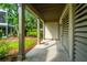 Exterior side porch with covered area and greenery, offering a peaceful spot for relaxation at 246 Slipper Shell Ct, Mount Pleasant, SC 29464