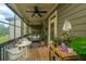 Charming screened porch with string lights, a ceiling fan, comfortable seating, and space for dining at 246 Slipper Shell Ct, Mount Pleasant, SC 29464