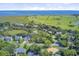 Stunning aerial view showcasing the home nestled near a lush golf course, waterway, and ocean at 261 Palm St, Mount Pleasant, SC 29464