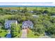 Scenic aerial view of the home, showcasing the landscaped yard and proximity to the golf course and ocean at 261 Palm St, Mount Pleasant, SC 29464