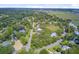 An aerial shot showcases an established neighborhood with lush greenery and tidy homes at 261 Palm St, Mount Pleasant, SC 29464