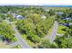 Aerial view showcasing the location near a golf course and coastal landscape, with the house nestled in a wooded area at 261 Palm St, Mount Pleasant, SC 29464