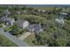 An aerial view of a well-maintained home with a driveway, surrounded by lush trees at 261 Palm St, Mount Pleasant, SC 29464