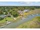 Expansive aerial view of waterfront homes with docks, lush greenery, and serene waterways at 261 Palm St, Mount Pleasant, SC 29464