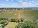 Breathtaking aerial view of marshland with walking paths and houses along the coastline at 261 Palm St, Mount Pleasant, SC 29464