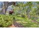 Spacious backyard showcasing mature trees, lush greenery, and outdoor privacy at 261 Palm St, Mount Pleasant, SC 29464