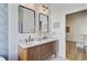 Bright bathroom featuring double vanity with marble countertop and modern fixtures at 261 Palm St, Mount Pleasant, SC 29464