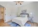 Cozy bedroom featuring wood floors, side tables, and natural light at 261 Palm St, Mount Pleasant, SC 29464
