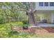 The backyard with a chair sitting beside a fire pit and stairs leading to a private deck at 261 Palm St, Mount Pleasant, SC 29464
