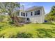 Back exterior of the home features a private deck, spacious patio, and lush backyard at 261 Palm St, Mount Pleasant, SC 29464