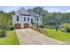 A beautifully designed two-story home with a well-manicured lawn and charming curb appeal at 261 Palm St, Mount Pleasant, SC 29464