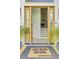 Welcoming front entrance with a decorative welcome mat and view of a staircase and interior at 261 Palm St, Mount Pleasant, SC 29464