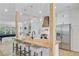Eat-in kitchen with stainless appliances, wooden island, and bar stool seating at 261 Palm St, Mount Pleasant, SC 29464