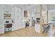 Well-appointed kitchen with island seating, stainless appliances, and custom cabinetry at 261 Palm St, Mount Pleasant, SC 29464