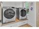 A well-lit laundry room with modern washer and dryer at 261 Palm St, Mount Pleasant, SC 29464