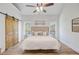 The bright main bedroom features a wooden sliding barn door at 261 Palm St, Mount Pleasant, SC 29464