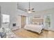 The bright main bedroom features a wooden sliding barn door at 261 Palm St, Mount Pleasant, SC 29464